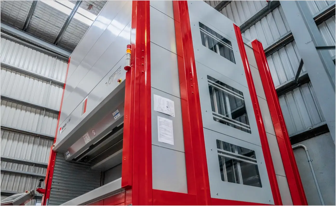 Vertical storage unit used to automatically store and retrieve inventory in a warehouse.